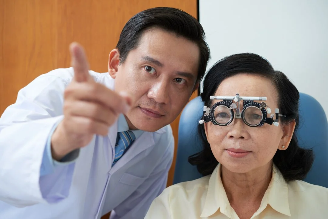 image of a elderly male patient having an eye sight check